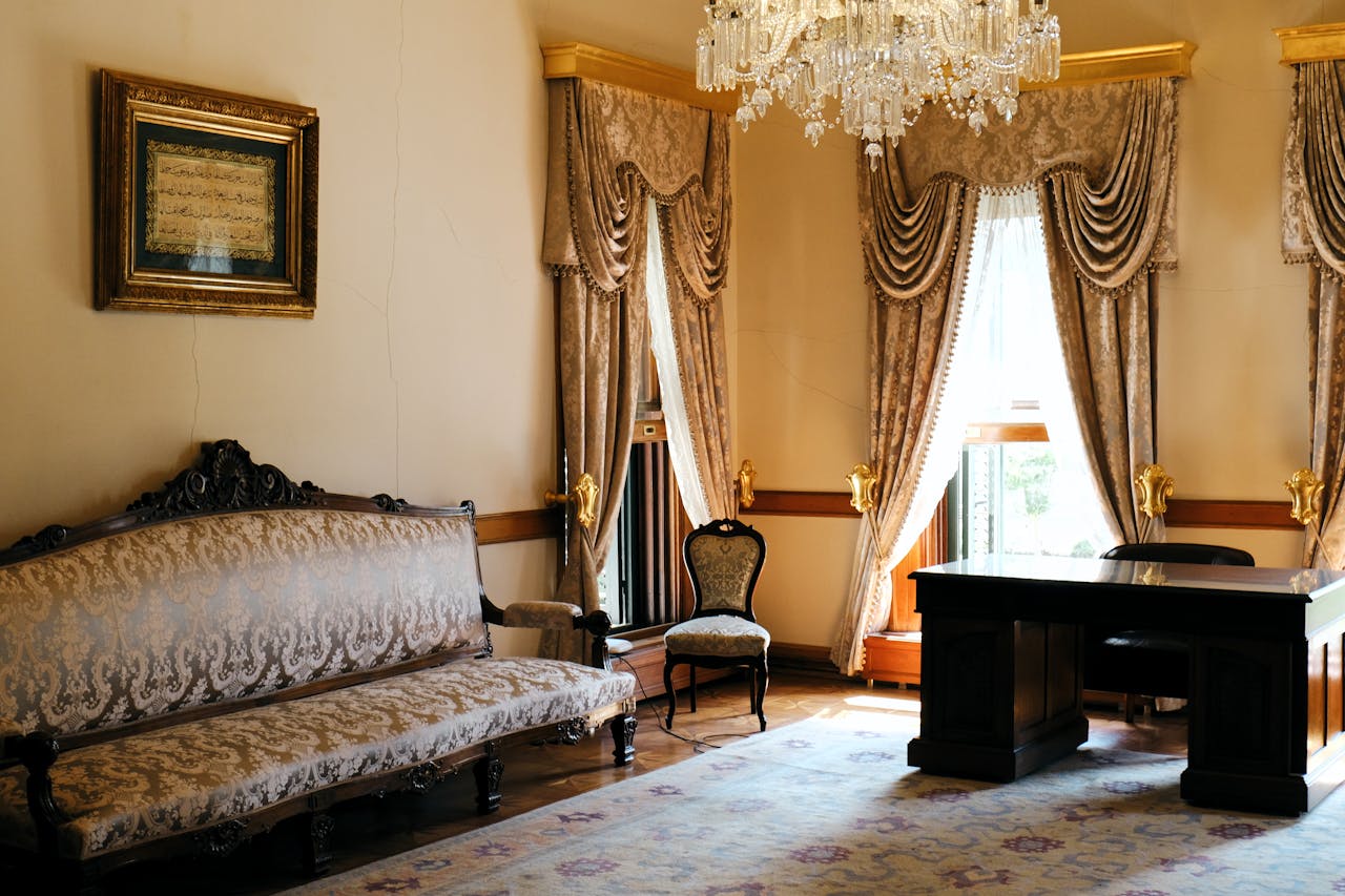 Luxurious Ottoman-style room in Istanbul with classic decor and a stunning chandelier.